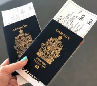 two Canadian passports with boarding passes