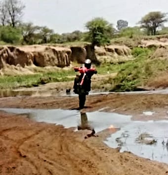 Dad is doing wheelies through the stream!